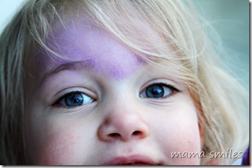 chalk on Emma's forehead