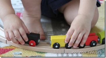 Johnny plays with his train set