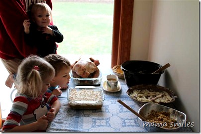 Emma, Johnny and Lily admire Thanksgiving dinner