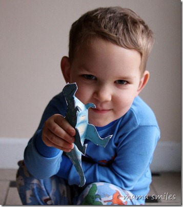 Johnny playing with his paper T-Rex