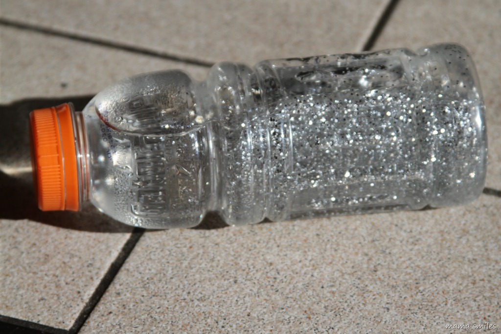 rolling water bottle filled with glitter