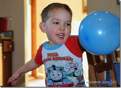 Johnny tests his volleyball serve on a balloon