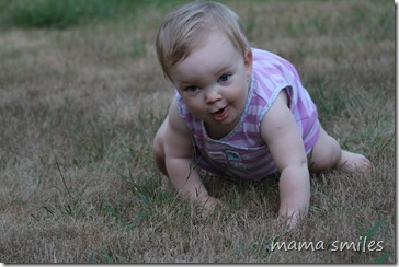 Lily crawling in grass