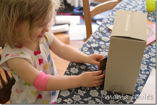 imaginative play with a cardboard house