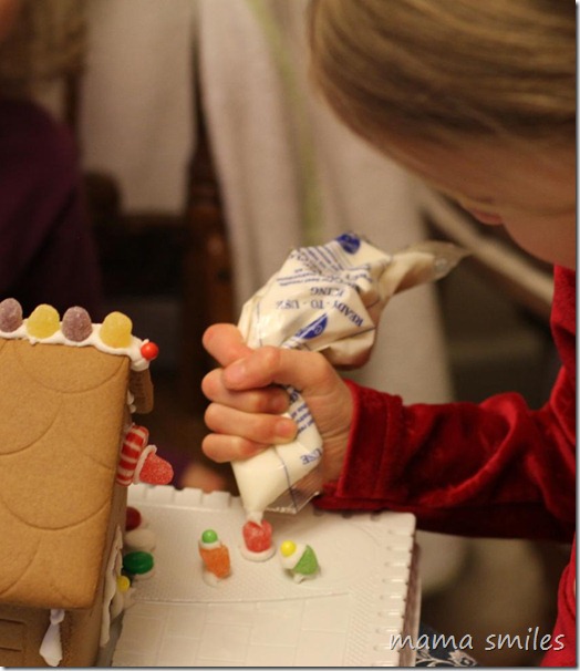 6yo decorating a gingerbread house