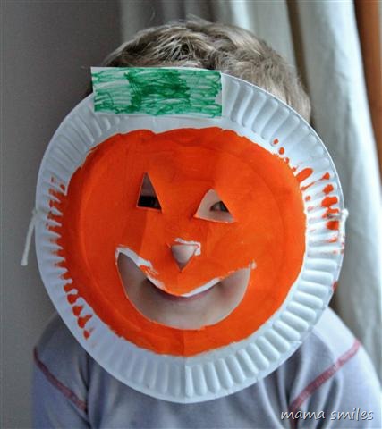 Johnny in his pumpkin jack o' lantern mask made from a paper plate