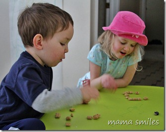 Emma and Johnny practice math using oatmeal squares