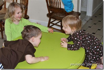 Emma, Johnny and Lily play at their little table