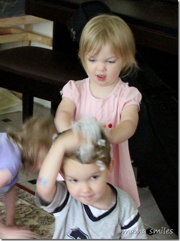 Lily "washes" Johnny's hair with polyester stuffing