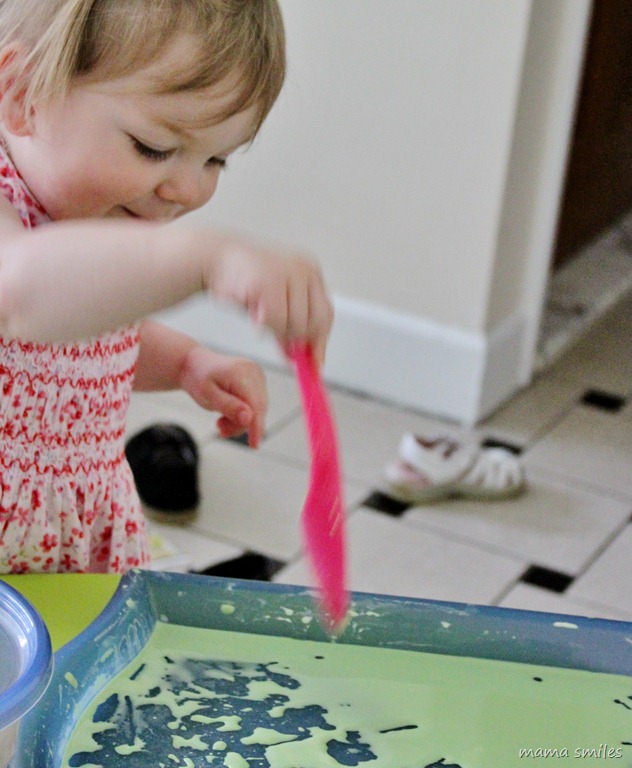 Lily plays with corn starch and water