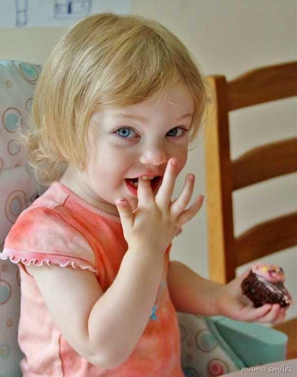 Lily enjoys the cupcake she decorated