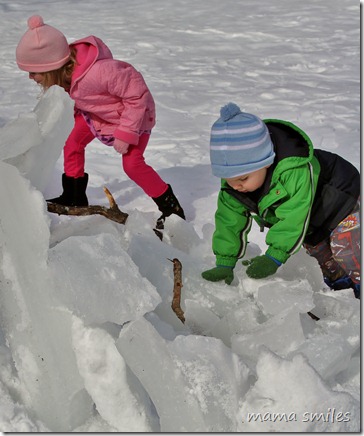 Emma and Johnny work on their ice fort