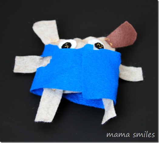 child-sewn stuffed dog with clothes