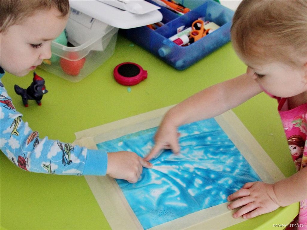 Johnny and Lily fingerpaint without making a mess