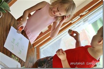 Emma and Johnny play with their Sugru-created stamps