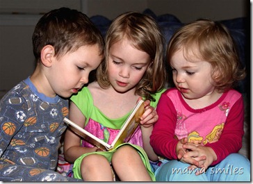 Emma reads a bedtime story to Johnny and Lily