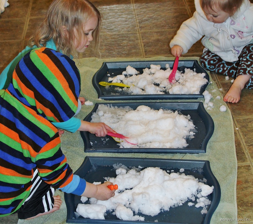 Emma, Johnny, and Lily play with snow brought in from outdoors