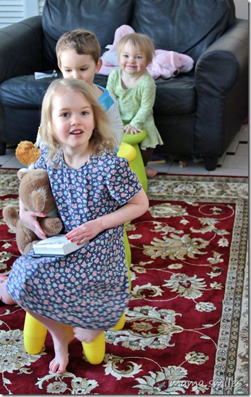 Emma, Johnny, and Lily on their play train built from IKEA stools