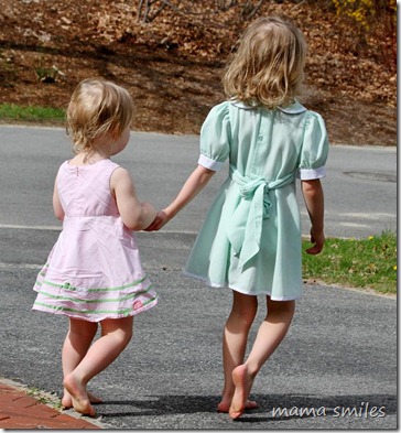 Lily and Emma hold hands