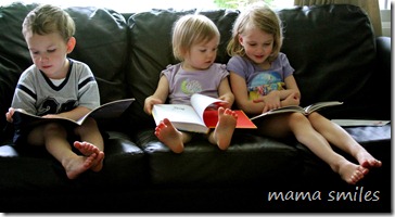 Emma, Johnny, and Lily read books on the couch