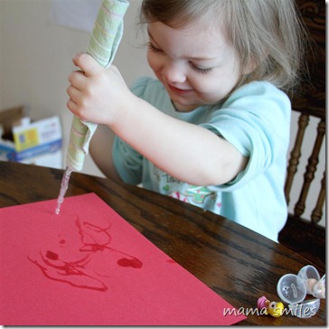 painting with an icicle on construction paper