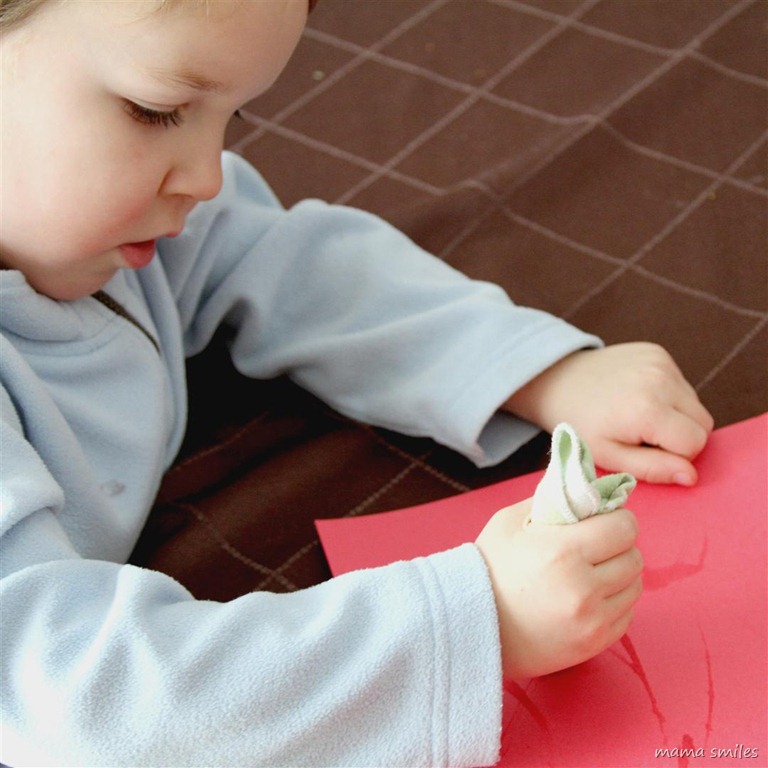 painting with an icicle on construction paper