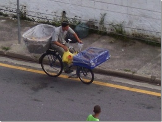 Man Selling Bread on Bike