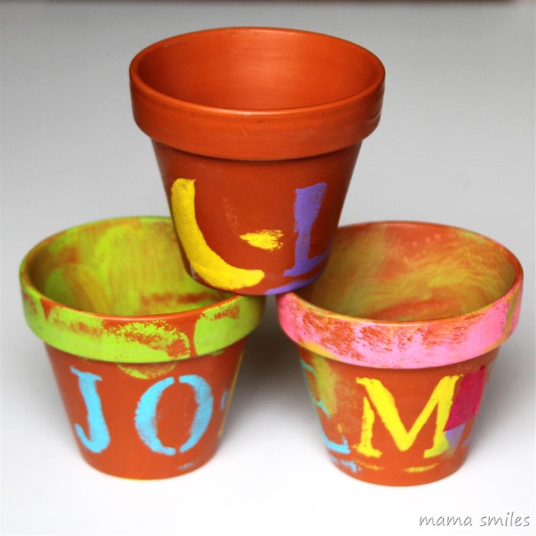 child-painted terra cotta clay pots