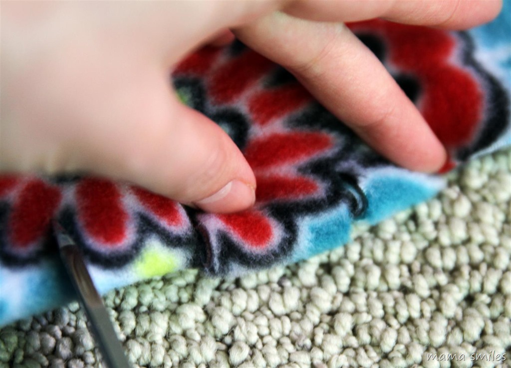 Making a no-sew fleece blanket from a single length of fleece - the fringe flips in on itself.