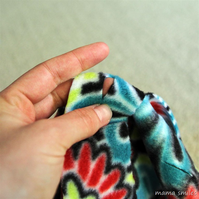 Flipping the decorative fringe on a no-sew fleece blanket