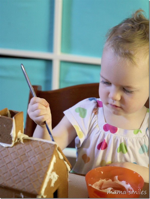even toddlers can decorate gingerbread houses with a little help.