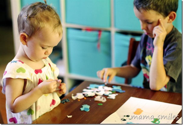 Sticker scenes are a low-mess toddler activity that helps kids develop fine motor skills.