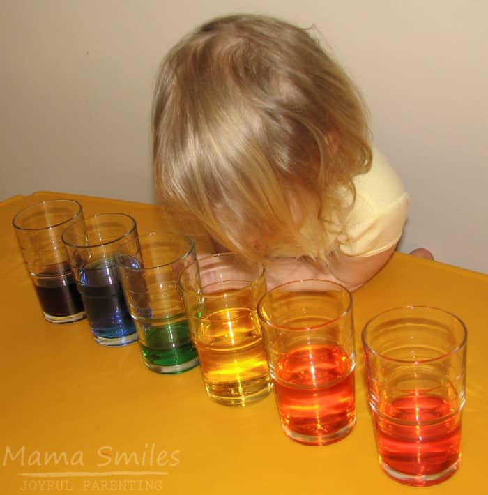 Explore fluid dynamics with this easy hands-on experiment. All you need for this simple physics for kids activity is glasses, water, and food coloring. The perfect preschool STEAM learning activity!