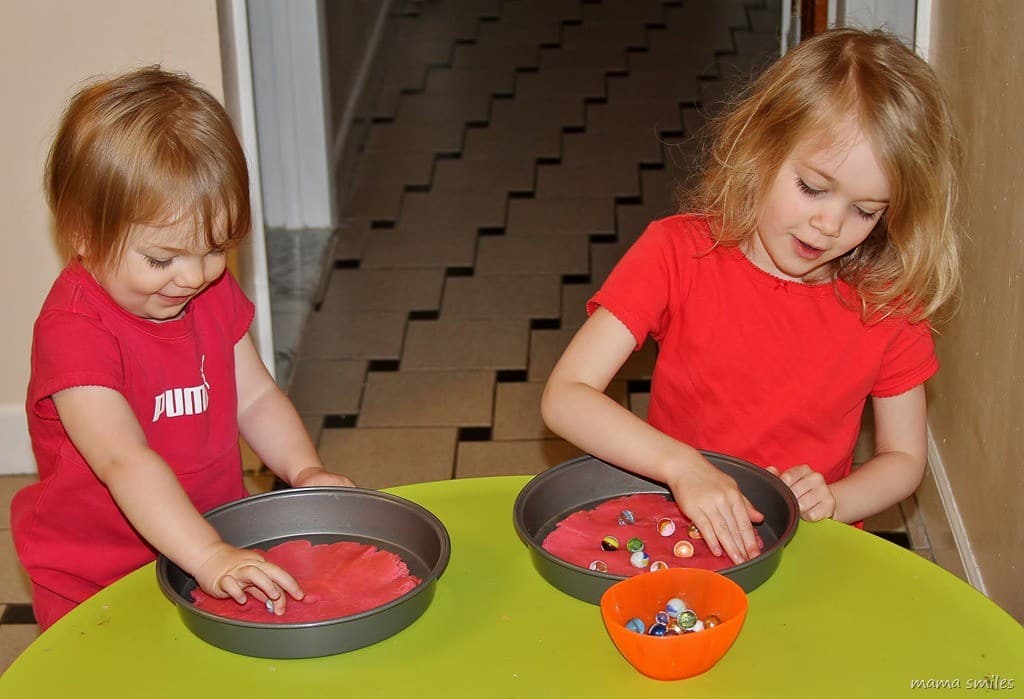 sensory play with play dough and marbles