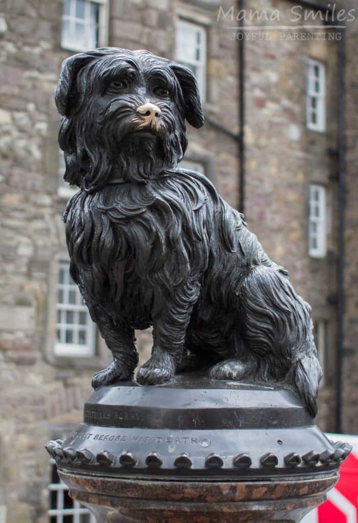 As you tour Scotland's capital city you'll notice people posing in front of a statue of a small dog. Learn the story of Greyfriars Bobby, the small hero behind this Edinburgh dog statue.