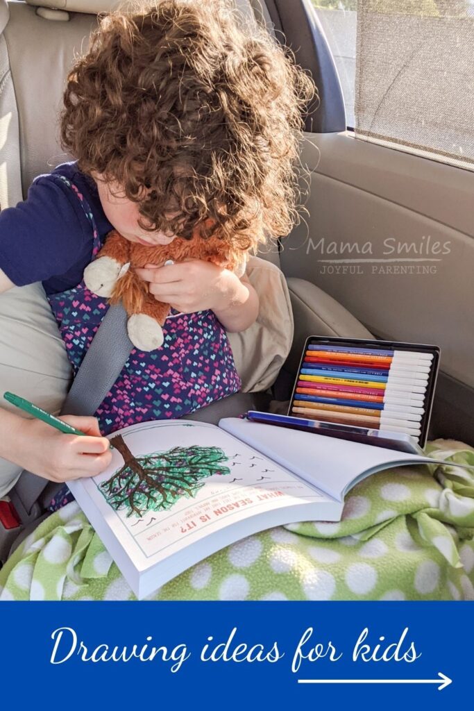 child drawing in a car