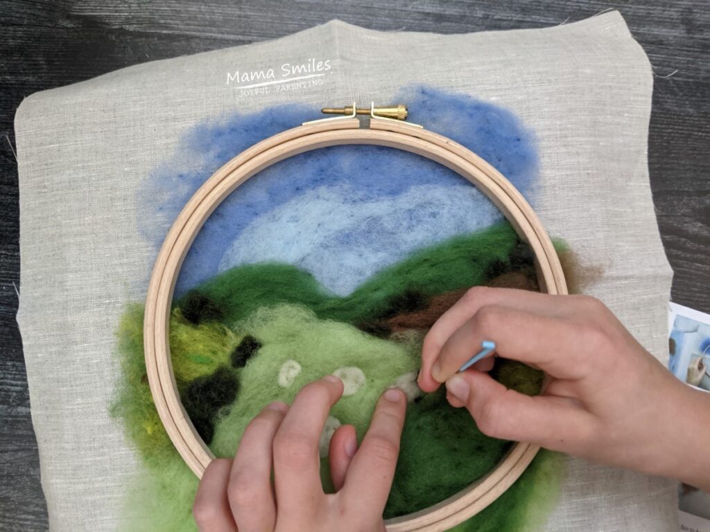 making a painting out of wool