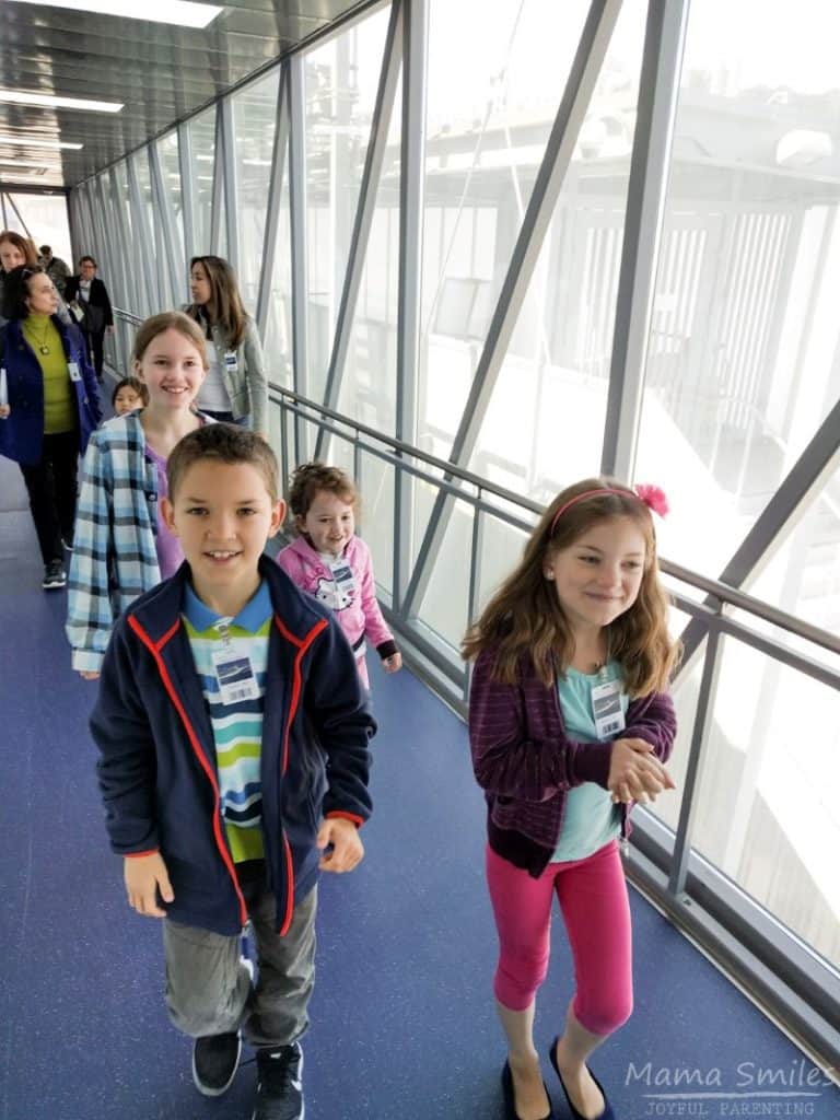 Going on board a cruise ship is a lot like boarding a plane, only friendlier, my kids said.